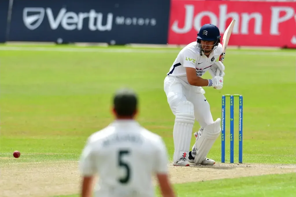 Holden century keeps Middlesex’s hopes alive against Kent